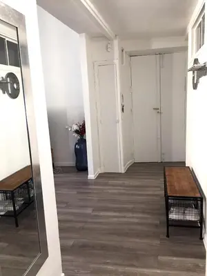 an empty hallway with a table and a door at Port de Nice in Nice