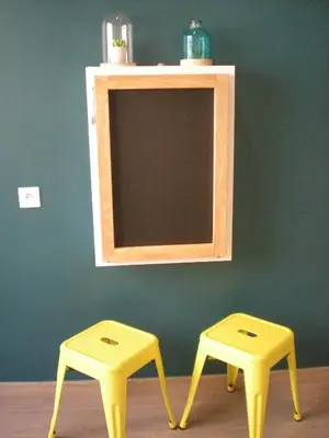 two yellow stools sitting in front of a mirror at Nicelidays - Le Berlioz - city central - 7min from beaches in Nice