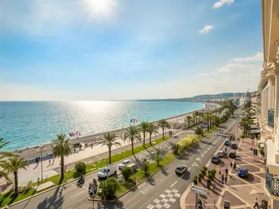 a view of a street in a city next to the ocean at Apartment Wilson by Interhome in Nice