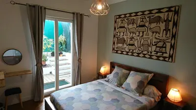 a bedroom with a bed and a large window at 6 bedrooms seaview house, Old Town in Nice