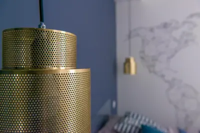 a gold polka dot cylinder in a room with a keyboard at Place Du Pin in Nice