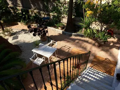 an overhead view of a table and chair on a staircase at Hotel Villa Rose in Nice