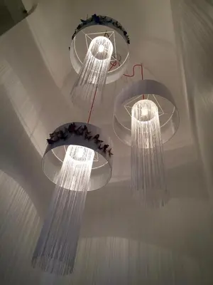 two chandeliers hanging from the ceiling in a room at Hotel Villa Rose in Nice
