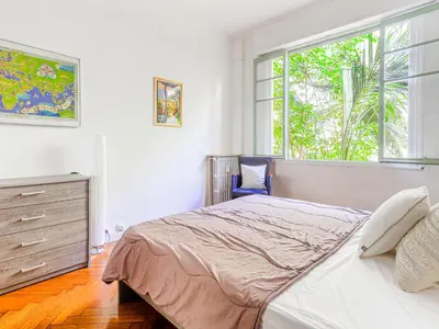 a bedroom with a bed and a dresser and a window at Apartment Le Rossi by Interhome in Nice