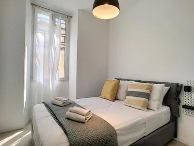 a bedroom with a bed with towels on it at Nestor&Jeeves - HOUSE OF CARDS - Central - Very close sea in Nice