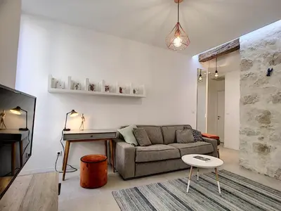 a living room with a couch and a table at Nestor&Jeeves - HOUSE OF CARDS - Central - Very close sea in Nice