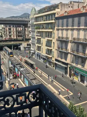 a view of a city with a train on a street at Studios Floreal in Nice