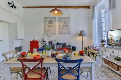 a dining room with a table and chairs at MY CASA - GARIB - Place Garibaldi - 4 bedrooms - Balcony in Nice
