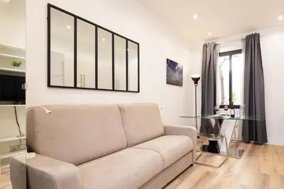 a living room with a couch and a glass table at 