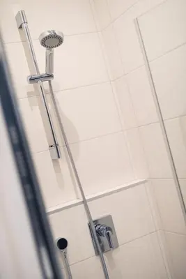a shower with a shower head in a bathroom at 