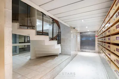 a hallway with a staircase in a building at Studio Massenet Five stars holiday house in Nice