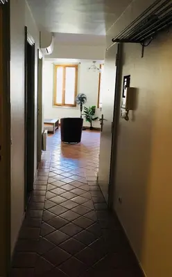 a hallway with a room with a tub in the distance at Appartement coeur du vieux Nice in Nice