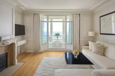 a white balcony with a view of the ocean at Grand-Hôtel du Cap-Ferrat, A Four Seasons Hotel in Saint-Jean-Cap-Ferrat