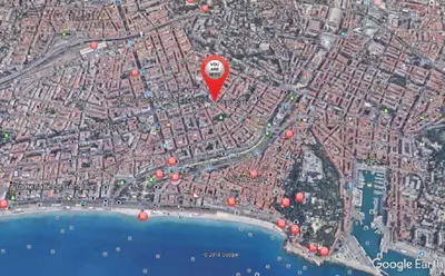 a red balloon is flying over a city at Nice Central Art Deco Flat 45 m² in Nice