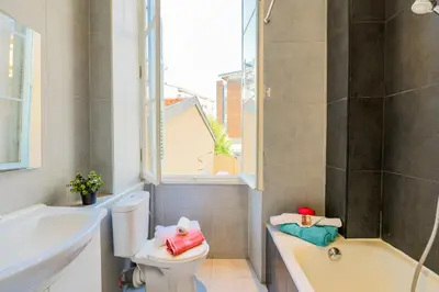 a bathroom with a toilet and a tub and a sink at CARRE D'OR TERRACE AP4015 NICE by Riviera Holiday Homes in Nice