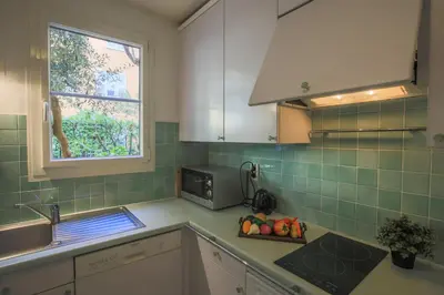 a kitchen with a sink and a microwave at La Providence Nice in Nice