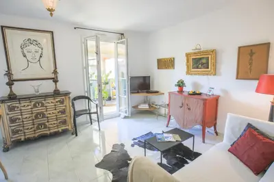 a living room with a couch and a table at La Providence Nice in Nice