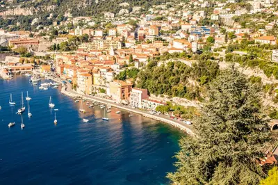 an aerial view of a harbor with boats in the water at RESIDENCE DU CAP AP2027 - Villefranche-sur-Mer, by Riviera Holiday Homes in Villefranche-sur-Mer