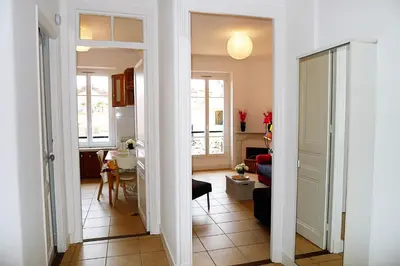 a hallway with a living room and a kitchen at LIBERATION - Nice in Nice