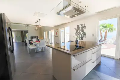 a kitchen with a large island and a living room at CORNICHE D'ARGENT - Nice in Nice