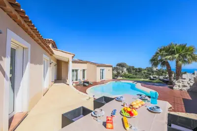 a villa with a swimming pool and a patio at CORNICHE D'ARGENT - Nice in Nice