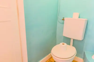 a bathroom with a toilet with a roll of toilet paper at VIA ITALIA AP1054 - By Riviera Holiday Homes in Nice