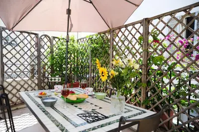 a white building with a gate in front of it at Suite ST Geneviève Five stars holiday house in Nice