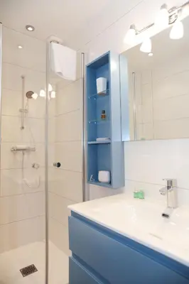 a bathroom with a shower and a sink and a mirror at Suite ST Geneviève Five stars holiday house in Nice