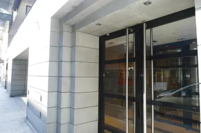a building with glass doors on the side of it at JARDINS MASSENA AP4088 Nice, by Riviera Holiday Homes in Nice