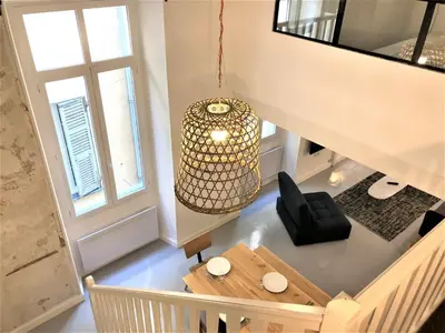 an overhead view of a living room with a chandelier at Prefecture Duplex - Old Town in Nice
