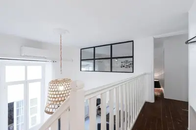 a living room with a couch and a table at Prefecture Duplex - Old Town in Nice