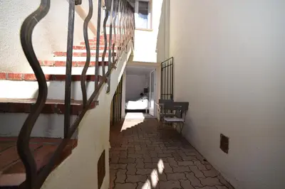 a hallway with a spiral staircase in a building at La Plenitude in Cagnes-sur-Mer