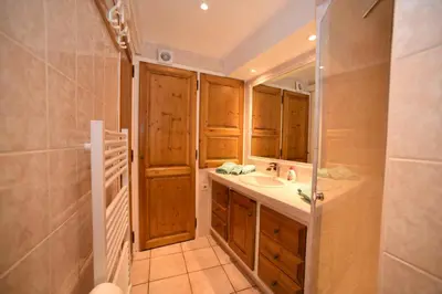 a bathroom with a sink and a mirror at La Plenitude in Cagnes-sur-Mer