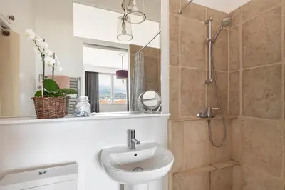 a bathroom with a sink and a shower at Unique sea view apartment, center, 100m2 in Nice