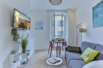 a living room with a couch and a table at MY CASA - 46 GIOFFREDO - Central 1 bedroom in Nice