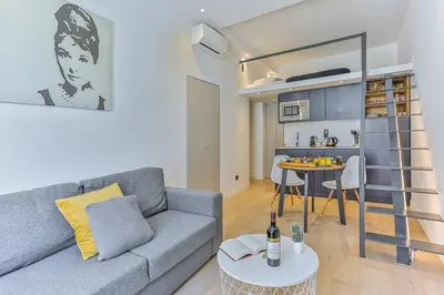 a living room with a couch and a table at MY CASA - 46 GIOFFREDO - Central 1 bedroom in Nice