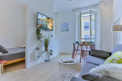 a living room with a couch and a table at MY CASA - 46 GIOFFREDO - Central 1 bedroom in Nice