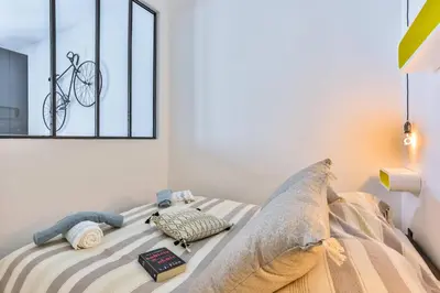 a bedroom with a bed with a pillow and a window at MY CASA - 46 GIOFFREDO - Central 1 bedroom in Nice