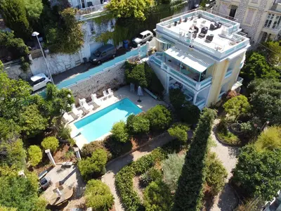 an aerial view of a building with a swimming pool at Villa Dracoena in Nice