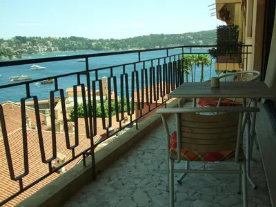 a room with glass doors with clouds on the wall at The Dina Palace. in Villefranche-sur-Mer