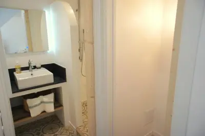 a bathroom with a sink and a mirror at Ze Perfect Place - Vieux Nice - Exceptionnel Appartement - Calme et Terrasse avec vues in Nice