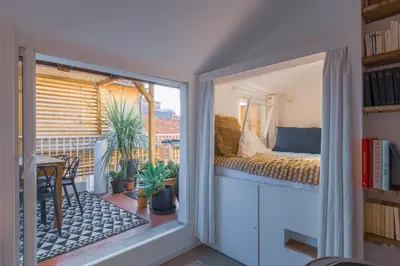 a room with a balcony with a bed and a window at Ze Perfect Place - Vieux Nice - Exceptionnel Appartement - Calme et Terrasse avec vues in Nice