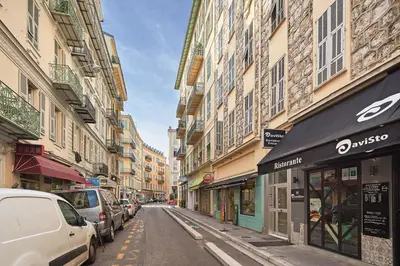 a city street with cars parked on the street at 