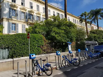 a row of blue bikes parked next to a building at Residence Blue Harmony in Nice