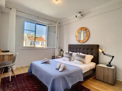 a bedroom with a bed with two towels on it at Nestor&Jeeves - FIORA PARADISE TERRACE - Central - Very close sea in Nice
