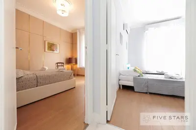 a small bedroom with two beds and a window at Suite Gioia five stars holiday house in Nice