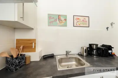 a kitchen with a sink and a counter top at Suite Gioia five stars holiday house in Nice