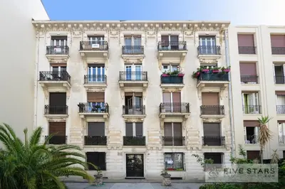 a tall building with windows and balconies on it at Suite Gioia five stars holiday house in Nice