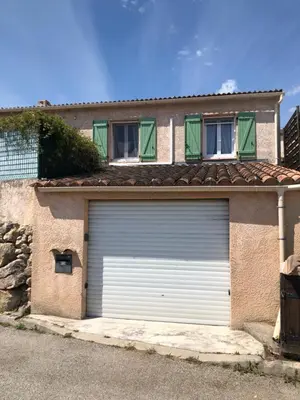 a garage door in front of a house at appartement en rez de villa in Gattières