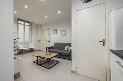 a living room with a couch and a table at Charming 1 Bdr Old town in Nice